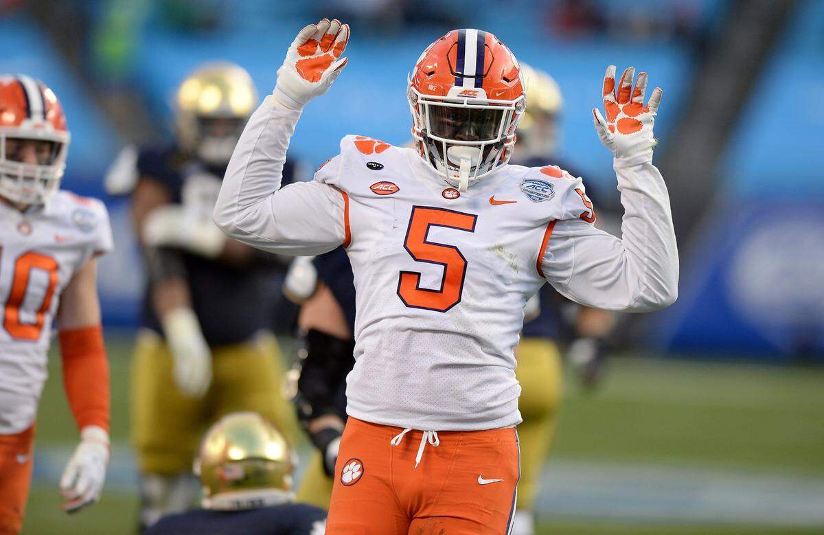 Clemson Tigers defensive end K.J. Henry celebrates his sack of Notre Dame quarterback Ian Book during second quarter action at Bank of America Stadium on Saturday, December 19, 2020 in Charlotte, NC. The Clemson Tigers and Notre Dame Fighting Irish faced off in the ACC Championship game.