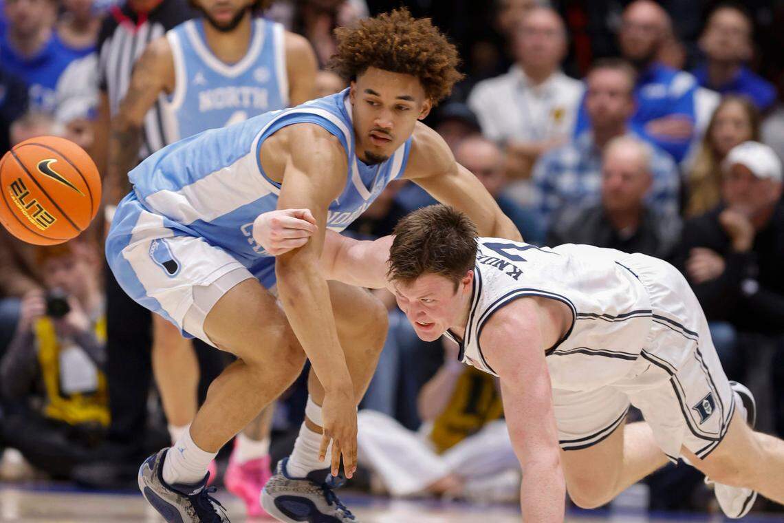 Duke’s Kon Knueppel (7) and North Carolina’s Seth Trimble (7) go after the ball during the first half of Duke’s game against UNC at Cameron Indoor Stadium in Durham, N.C., Saturday, Feb. 1, 2025.