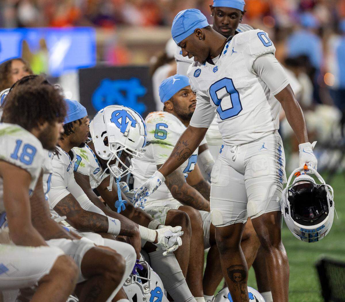North Carolina’s Tychaun Chapman (0) consoles teammate Armani Chatman (9) during the closing minute of play as Clemson secure their 31-20 victory on Saturday, November 18, 2023 at Memorial Stadium in Clemson, S.C.