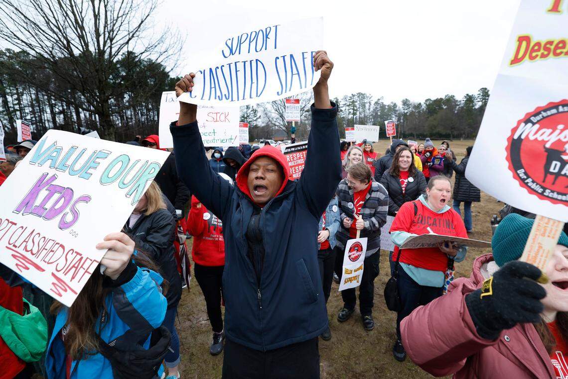Daniel Kemp, a teacher at Riverside High School, cheers on the speakers during a rally at Durham Public Schools Staff Development Center in Durham, N.C., Wednesday, Jan. 31, 2024.