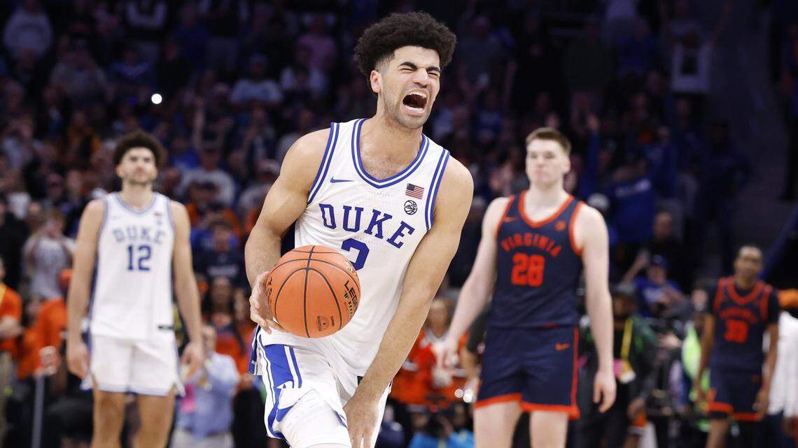 Duke’s Cayden Boozer (2) celebrates as time runs out in Duke’s 74-70 victory over Virginia in the finals of the 2026 ACC Men’s Basketball Tournament at the Spectrum Center in Charlotte, N.C., Saturday, March 14, 2026.