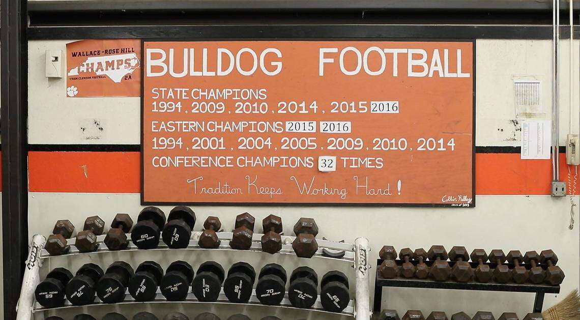 In the weight room at Wallace-Rose Hill High School, a reminder of the success of the Bulldog’s program including seven state championships, one from 2017 that hasn’t been added on Friday, October 5, 2018 in Seven Springs, N.C.