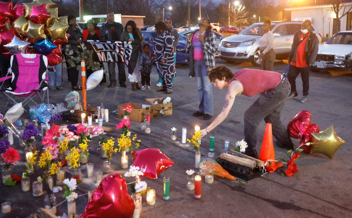 Candles are placed at a memorial for Darryl Williams outside Supreme Sweepstakes in Raleigh, N.C., Thursday evening, Jan. 19, 2023.