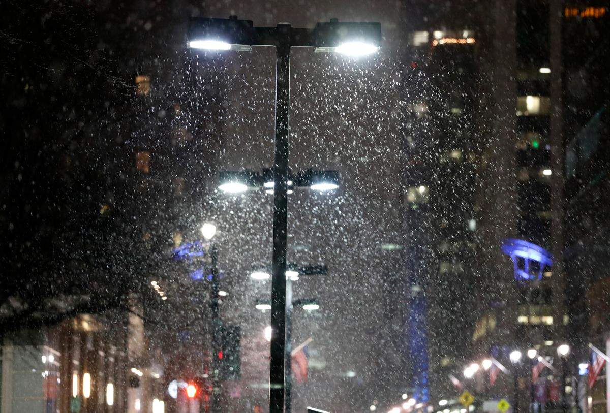 Snow falls in downtown Raleigh, N.C. early Thursday morning, January 28, 2021.