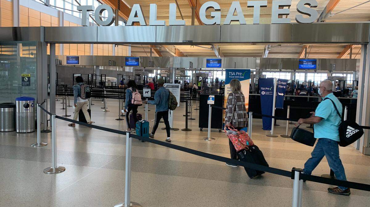 Passengers head for the TSA security checkpoint in Terminal 2 at Raleigh-Durham International Airport on Monday, May 24. This coming Memorial Day weekend is expected to be the airport’s busiest time since before the coronavirus pandemic began.
