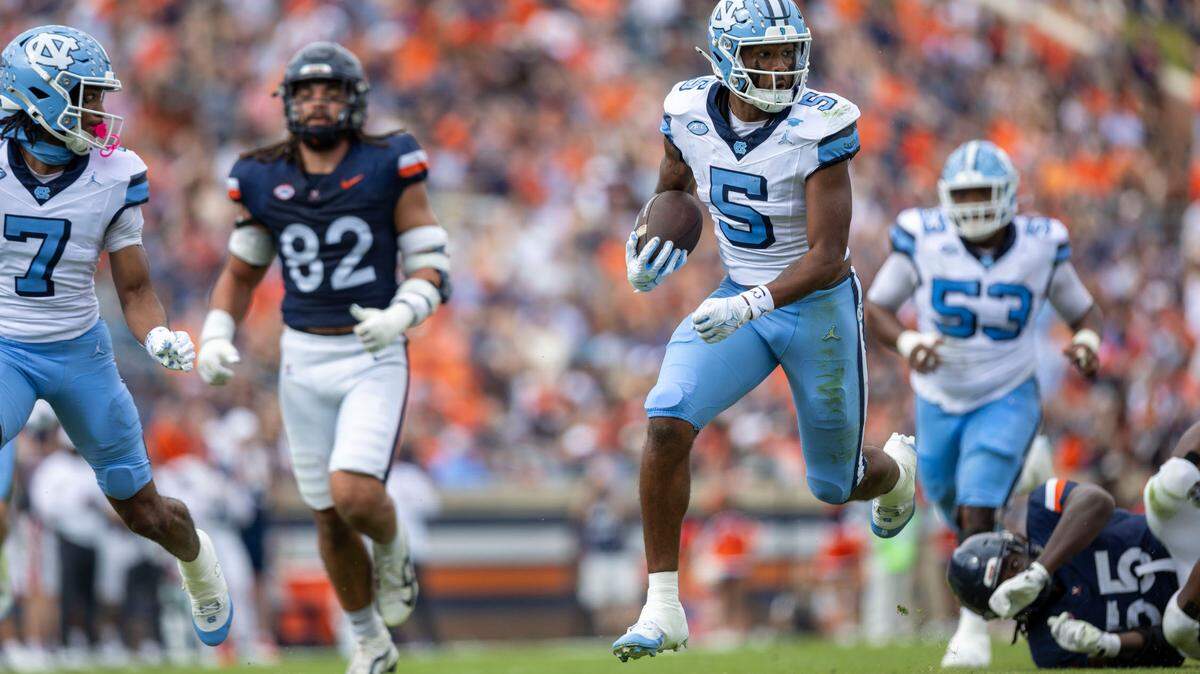 North Carolina wide receiver J.J. Jones (5) scores on a 37-yard pass from Jacolby Criswell to give the Tar Heels’ a 7-3 lead over Virginia in the first quarter on Saturday, October 26, 2024 at Scott Stadium in Charlottesville, Va.