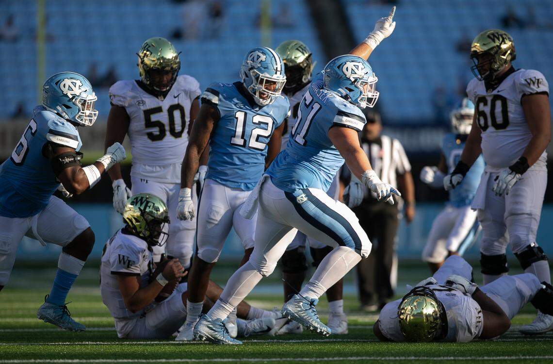 North Carolina’s Raymond Vohasek (51) reacts after sacking Wake Forest quarterback Sam Hartman (10) for an eight-yard loss in the fourth quarter at Kenan Stadium on Saturday, November 14, 2020 in Chapel Hill, N.C.