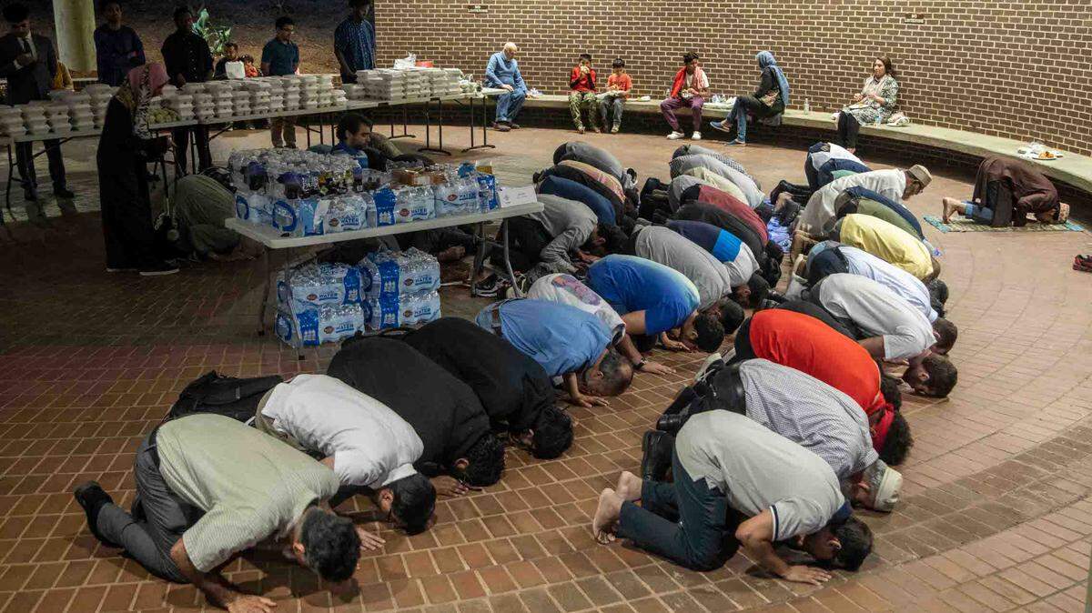 Area Muslims pray and break fast outside a Raleigh City Council meeting Tuesday, April 4, 2023. Some community members worry that the Shaw University closed its mosque to the public “as a stalling measure while it seeks rezoning to redeveloped parts of its historic campus,” The News & Observer previously reported.