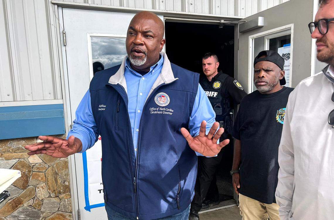 North Carolina Lt. Gov. Mark Robinson speaks with media outside the Ag Center Shelter near the Asheville Regional Airport in Asheville, NC, during the aftermath of flooding caused by Hurricane Helene on Sept. 29, 2024. Helene’s swath of destruction brought historic rainfall, flooding, power outages and 140-mile-an-hour winds across the Southeast. North Carolina that bore the brunt of damage, with vast swaths of cities like Asheville underwater, residents trapped in their homes with no lights or food and few functioning roads for rescue workers to help them.