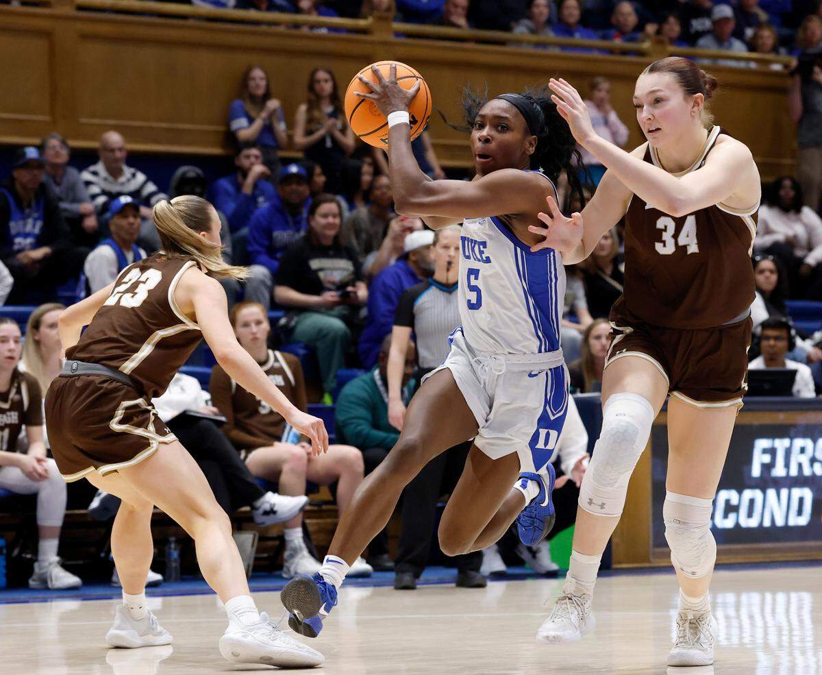 Duke’s Oluchi Okananwa drives past Lehigh’s Gracyn Lovette and Lily Fandre during the first half of the Blue Devils’ 86-25 win in the first round of the NCAA Tournament on Friday, March 21, 2025, at Cameron Indoor Stadium in Durham, N.C.