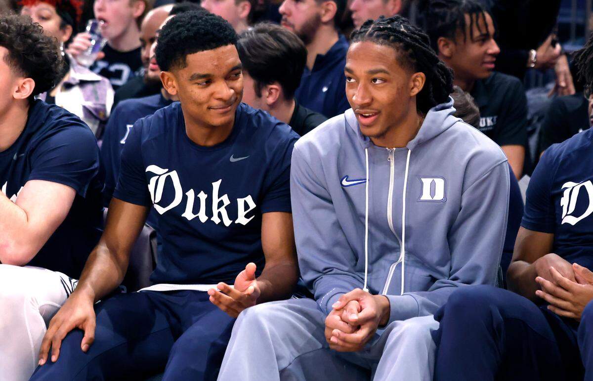 Duke’s Caleb Foster, left, talks with Maliq Brown, during the second half of Duke’s 110-67 victory over Illinois in the SentinelOne Classic at Madison Square Garden in New York City Saturday, Feb. 22, 2025.