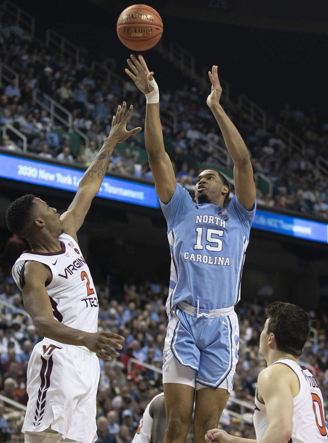 North Carolina’s Garrison Brooks (15) shoots over Virginia Tech’s Landers Nolley II (2) during the first half on Tuesday, March 10, 2020 during the first round of the ACC Tournament at the Greensboro Coliseum in Greensboro, N.C.