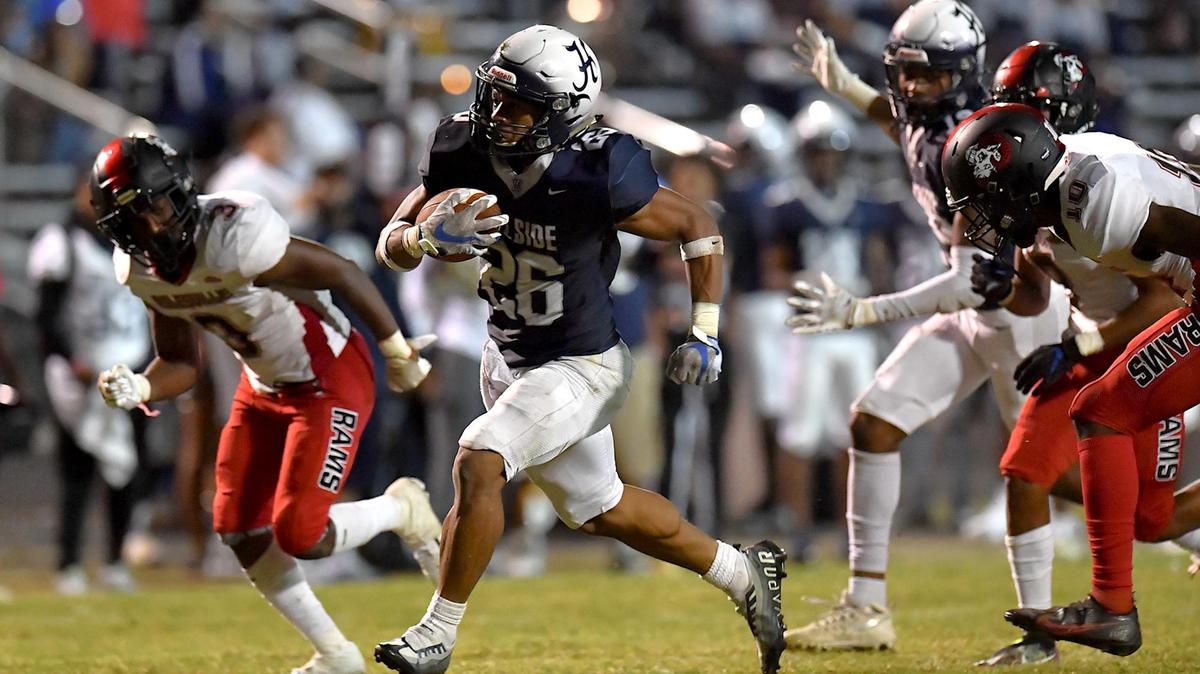 Hillside’s Jimmyll Williams (26) sprints for the touchdown ahead of the Rolesville defense in the second half. The Durham Hillside Hornets and the Rolesville Rams met in a football game in Durham, N.C. on September 9, 2022.