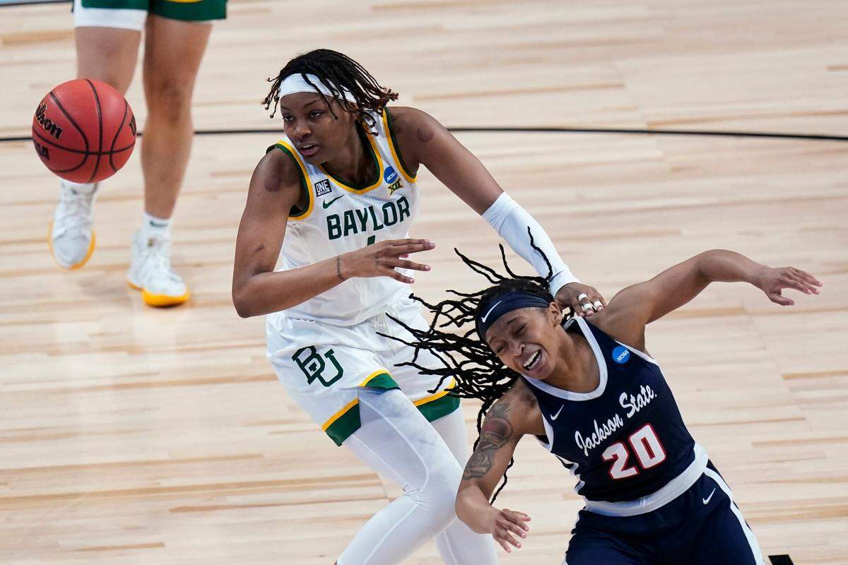 Baylor forward NaLyssa Smith, left, fights for a loose ball with Jackson State guard J’Niya Tallie (20) during the second half of a college basketball game in the first round of the women’s NCAA tournament at the Alamodome, Sunday, March 21, 2021, in San Antonio. (AP Photo/Eric Gay)