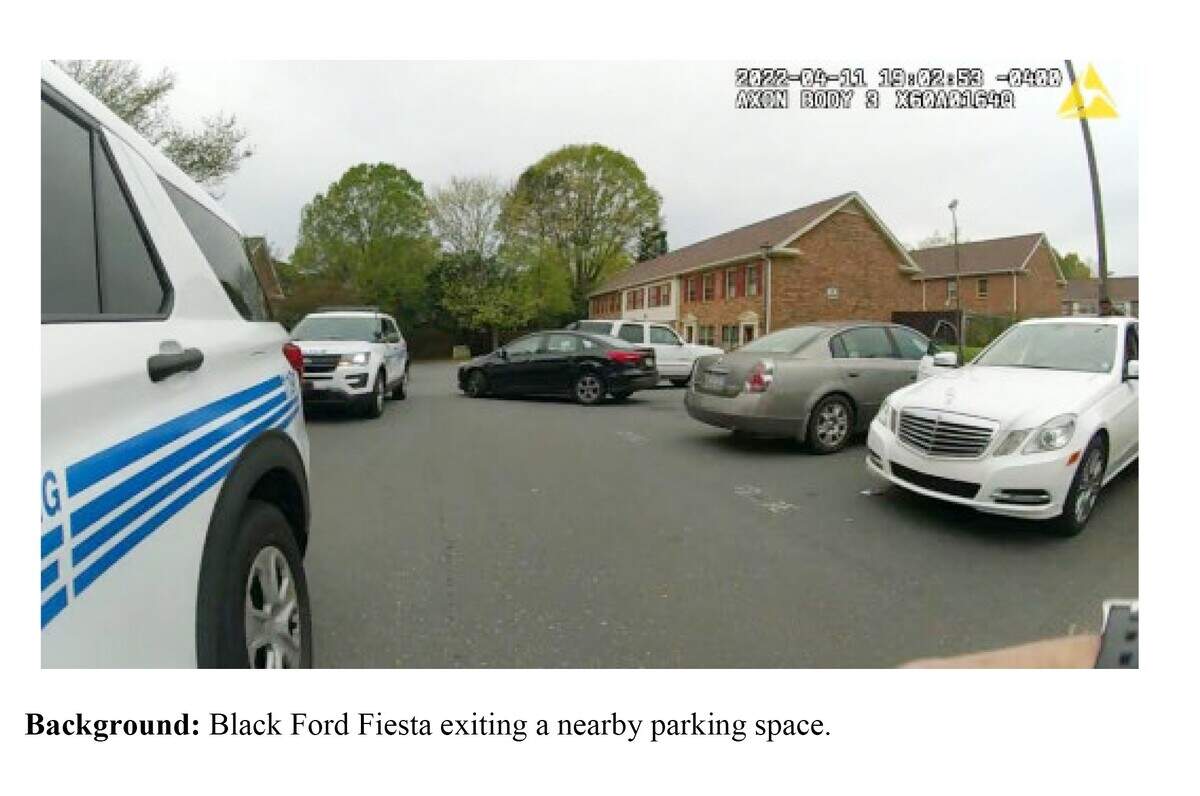 A screenshot from police video show a Charlotte-Mecklenburg police SUVs parked in the middle of the street, partially blocking Kevin Williams’ white Mercedes.