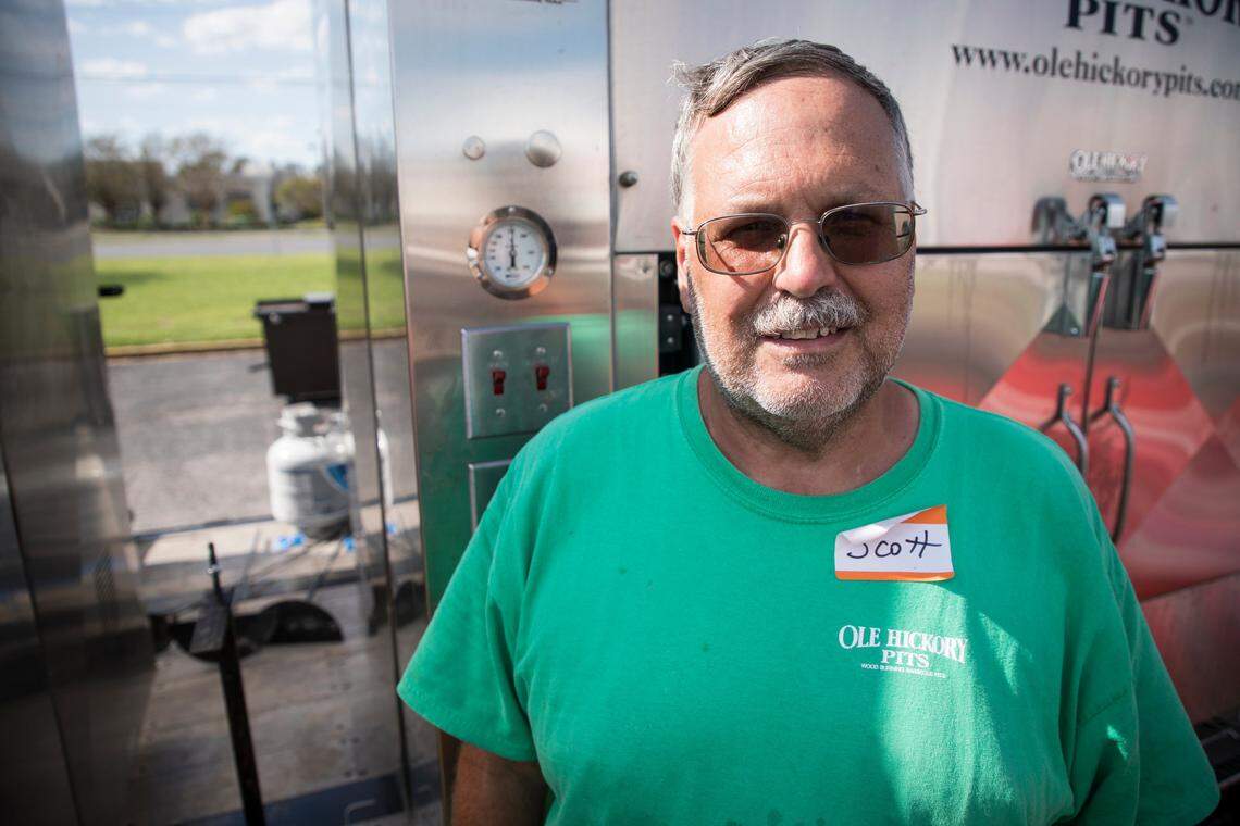 Scott Jarrett, of Hickory, poses for a portrait in front of Operation BBQ Relief’s smokers in Wilmington on Wednesday, Sept. 19, 2018. Jarrett is the lead organizer for the group’s efforts in North Carolina.