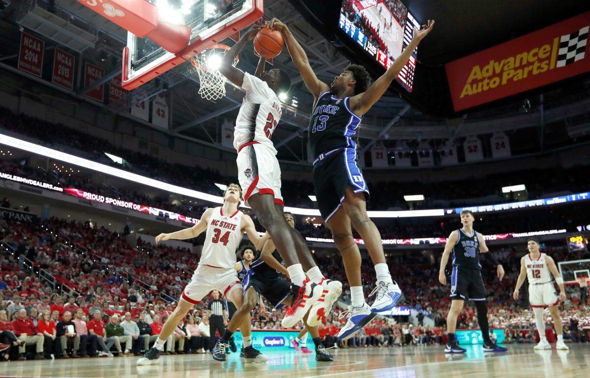 Duke’s Sean Stewart (13) blocks the shot by N.C. State’s Mohamed Diarra (23) during Duke’s 79-64 victory over N.C. State at PNC Arena in Raleigh, N.C., Monday, March 4, 2024.