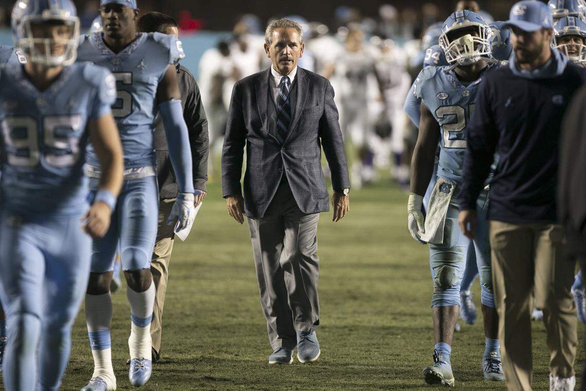 North Carolina athletic director Bubba Cunningham leaves the field with the football team following their second win of the season against Western Carolina on Saturday, November 17, 2018 at Kenan Stadium in Chapel Hill.