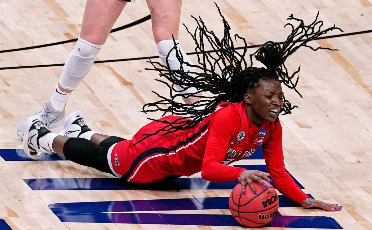 Stony Brook guard Asiah Dingle chases a loose ball during the second half of a college basketball game against Arizona in the first round of the women’s NCAA tournament at the Alamodome in San Antonio, Monday, March 22, 2021. 