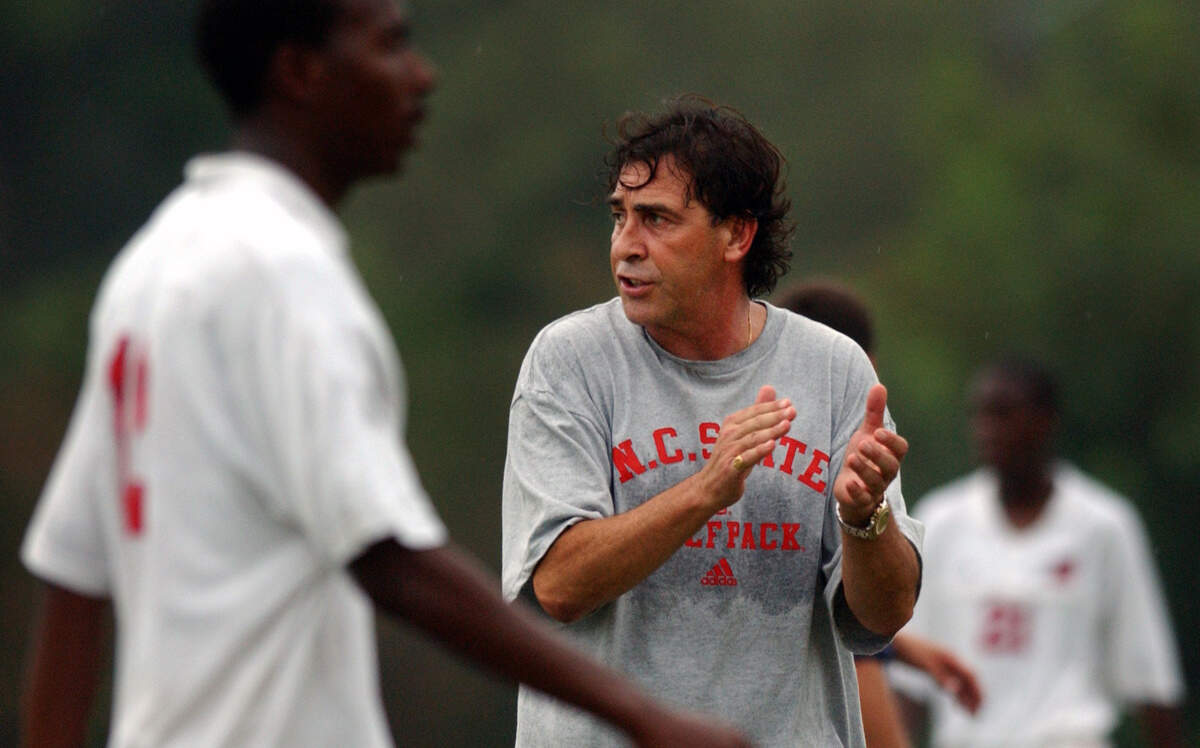 N.C. State men's soccer head coach George Tarantini encourages his team in 2002.