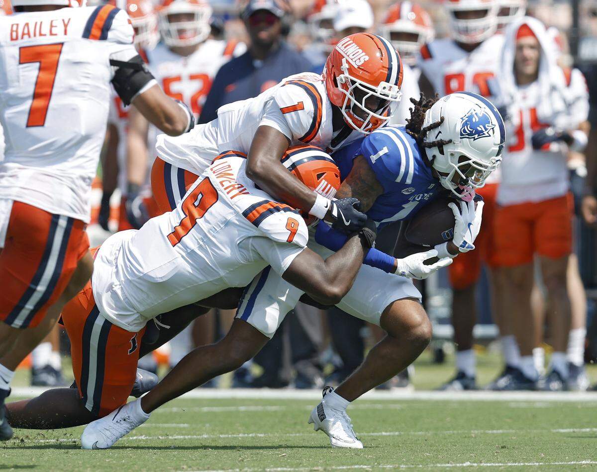 Duke’s Andrel Anthony is tackled by Illinois’ Leon Lowery Jr. and Kaleb Patterson during the first half of the Blue Devils’ game on Saturday, Sept. 6, 2025, at Wallace Wade Stadium in Durham, N.C.