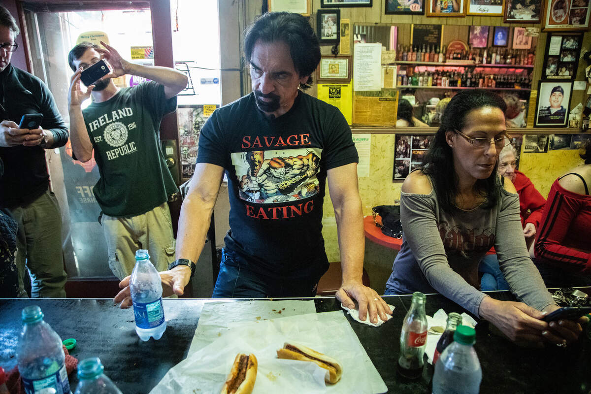 Gregory Scott Wilson forced down 27 fully loaded chili dogs in 51 minutes Wednesday, breaking the record at The Roast Grill in Raleigh.