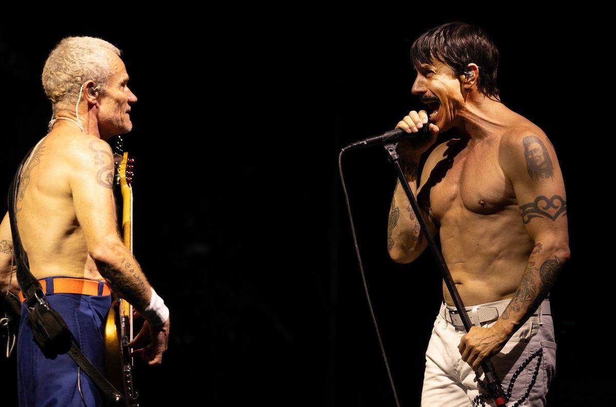 Red Hot Chili Peppers lead singer Anthony Kiedis joined the always bare chested Flea on a hot night in Raleigh.