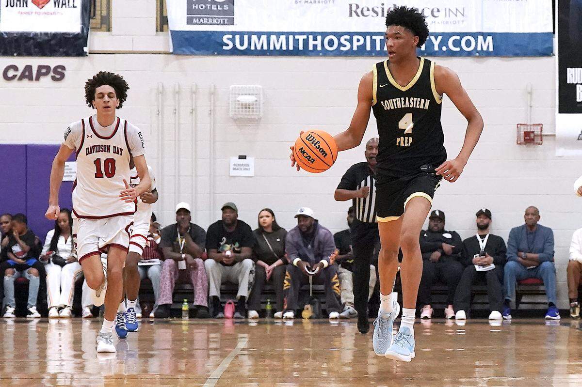 Southeastern Prep's CJ Rosser, Jr. (4) brings the ball downcourt ahead of Davidson Day's Cody Peck (10) during the first half. The Davidson Day Patriots and the Southeastern Prep Academy National Falcons met in the John Wall Holiday Tournament in Raleigh, N.C. on December 27, 2025.