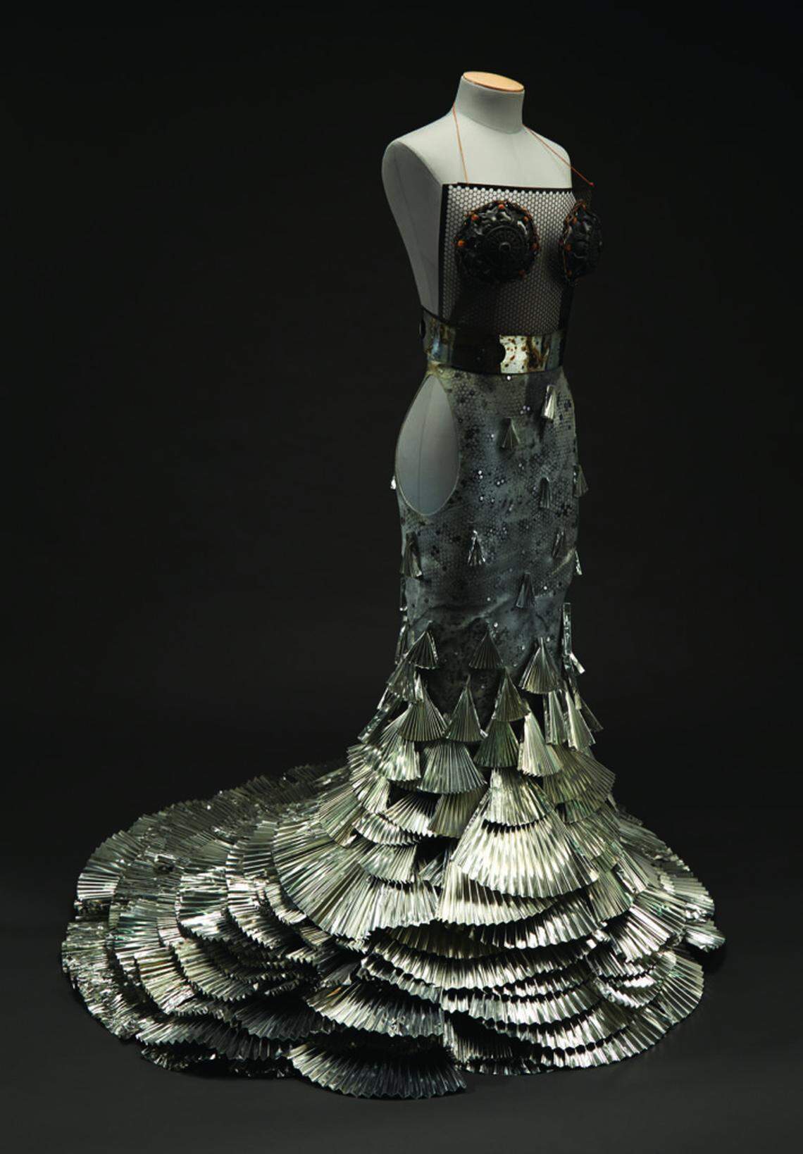 This aluminum Art 2 Wear dress, made by Veronica Tibbitts in 2011, is in the exhibit “All That Glitters” at N.C. State University’s Gregg Museum of Art & Design. It can be seen in a virtual gallery space.