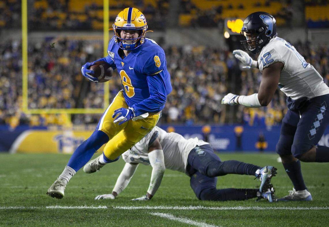 Pittsburgh quarterback Kenny Pickett (8) scores a touchdown on a two-yard run to give Pitt a 10-7 lead over North Carolina in the second quarter on Thursday, November 14, 2019 at Heinz Field in Pittsburgh, Pa.