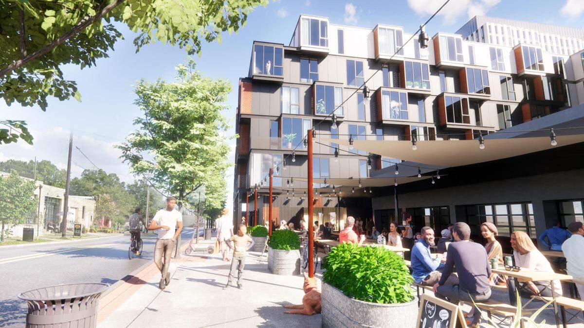 A rendering shows the potential future exterior of a renovated Motorco Music Hall in Durham with apartments connected to it.
