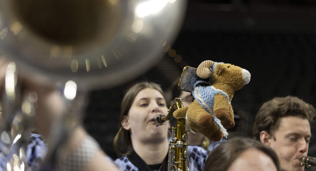 A North Carolina pep-band member sports a Rameses doll on her saxophone during the Tar Heels’ practice on Wednesday, March 18, 2026 in Greenville, S.C.