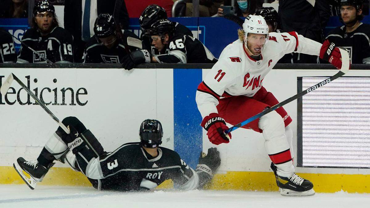 Carolina Hurricanes center Jordan Staal (11) collides with Los Angeles Kings defenseman Matt Roy (3) during the first period of an NHL hockey game Saturday, Nov. 20, 2021, in Los Angeles. (AP Photo/Marcio Jose Sanchez)