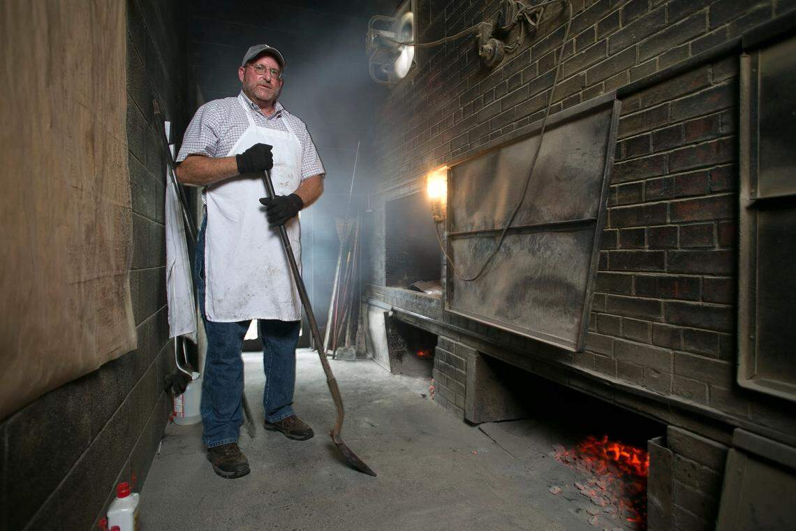 Owner Andy Stephenson works in the pit room at Stephenson’s Bar-B-Q north of Benson.