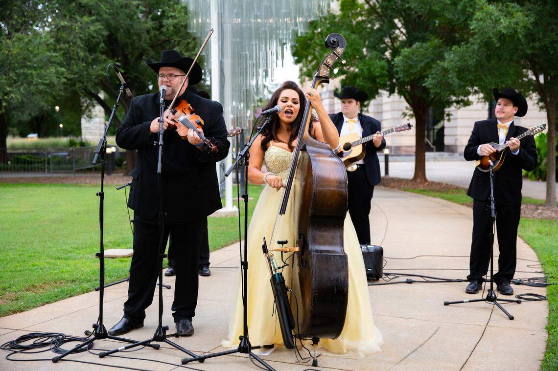 Dewey & Leslie Brown and The Carolina Gentlemen perform outside the Duke Energy Center for the Performing Arts. The performance will be shown as part of IBMA’s World of Bluegrass virtual event. IBMA World of Bluegrass will run from Sept. 28 to Oct. 3. The festival part of the annual event, which would normally be on the streets of Raleigh and at local venues, will be online Oct. 2-3.