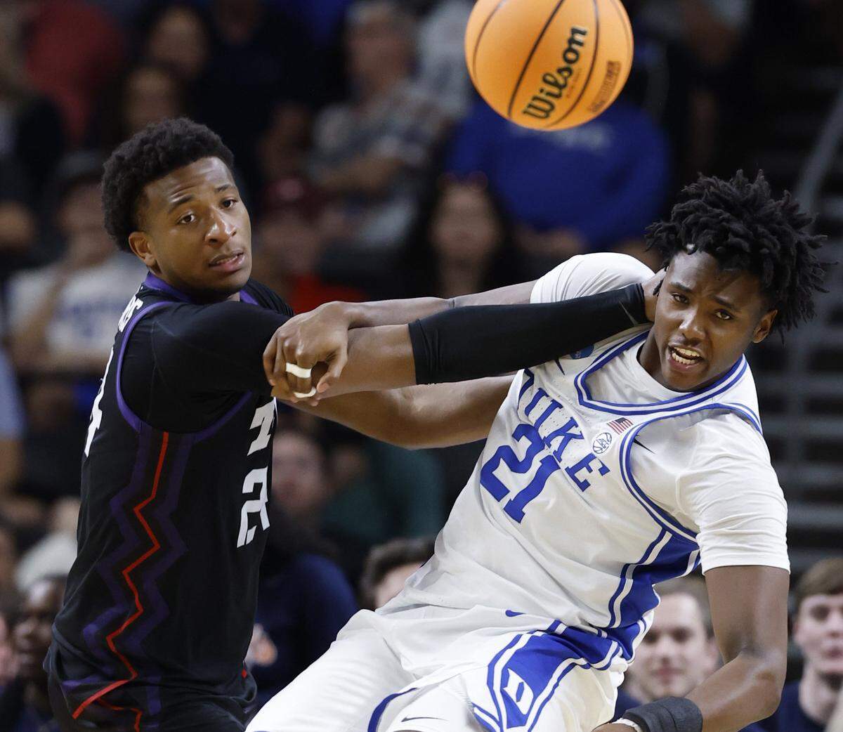 TCU’s Xavier Edmonds (24) and Duke’s Patrick Ngongba II (21) look for the ball after Ngongba II blocked the shot during the second half of Duke’s 81-58 victory over TCU in the second round of the NCAA Men’s Basketball Tournament at  Bon Secours Wellness Arena in Greenville, S.C., Saturday, March 21, 2026.