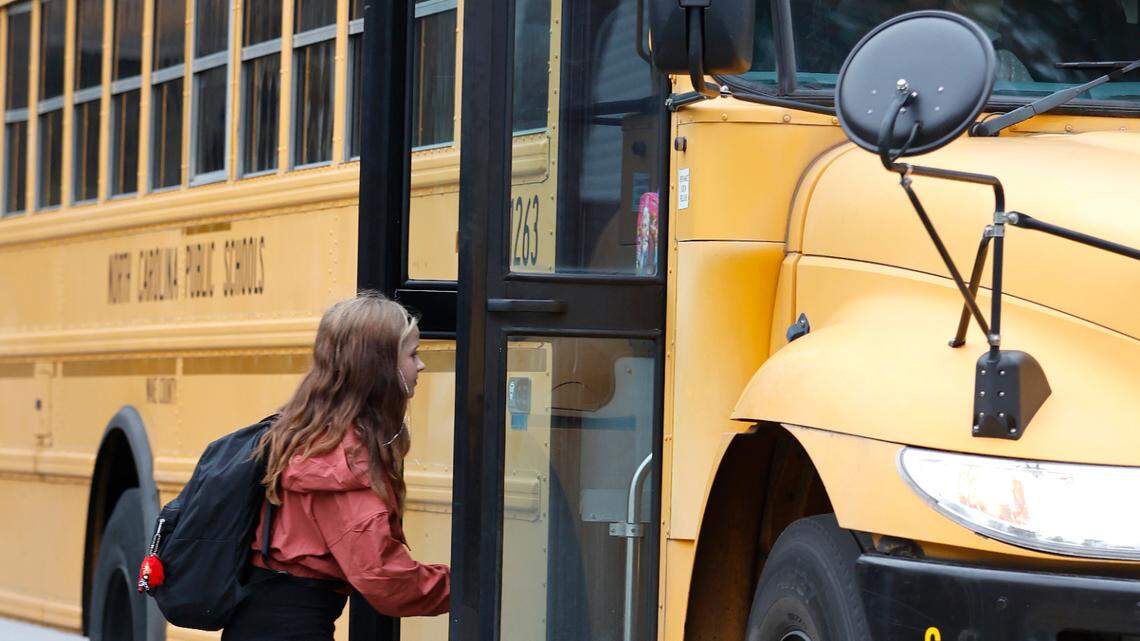 Ady Wilson, a fourth-grader at Farmington Woods Elementary School, boards her school bus Thursday morning, Jan. 12, 2023.
