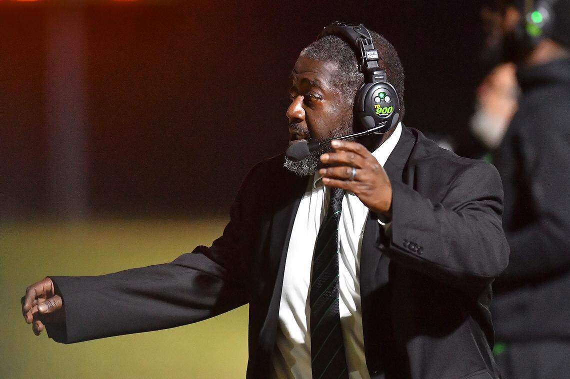 Cary football head coach Coleman Tyrance watches the setup on the field against Middle Creek during the first half. The Cary Imps and the Middle Creek Mustangs met in a conference football game in Cary, N.C. on October 24, 2025