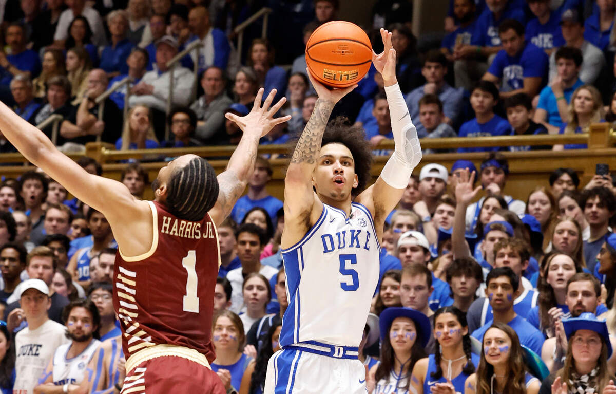 Duke’s Tyrese Proctor (5) shoots as Boston College’s Claudell Harris Jr. (1) defends during the first half of Duke’s game against Boston College at Cameron Indoor Stadium in Durham, N.C., Saturday, Feb. 10, 2024.
