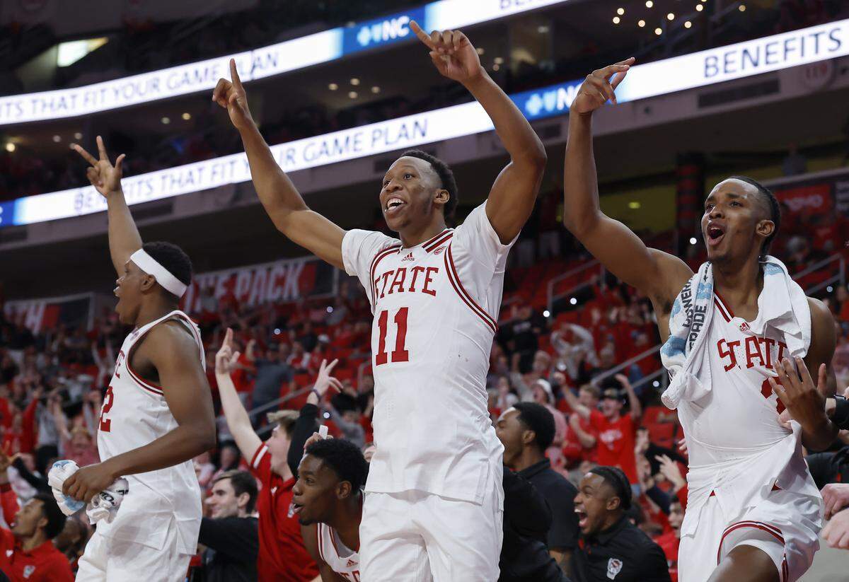 N.C. State’s Quadir Copeland, center, reacts on the bench during the second half of the Wolfpack’s 114-66 win over North Carolina Central at Lenovo Center on Monday, Nov. 3, 2025, in Raleigh, N.C.