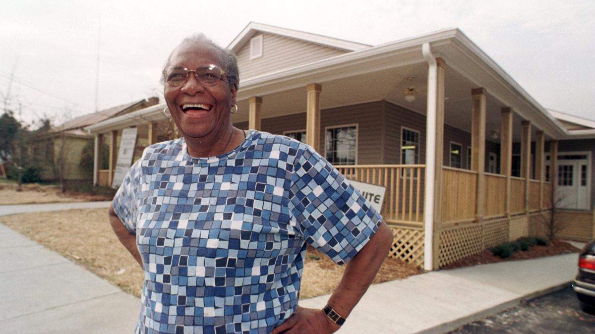 Mildred Council, aka Mama Dip, takes a moment's break in front of her new Mama Dip's Kitchen, 408 W. Rosemary St., in 1999.
