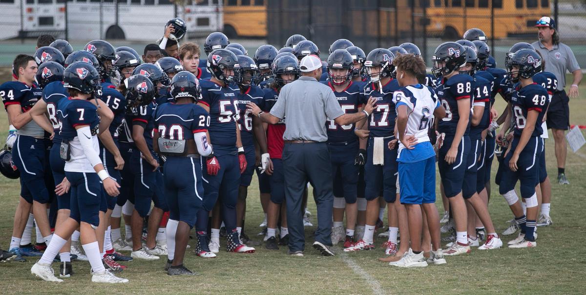 Apex Friendship coach Adam Sanders talks with his players prior to the conclusion of their game against Middle Creek on Monday, September 30, 2019 in Apex, N.C.