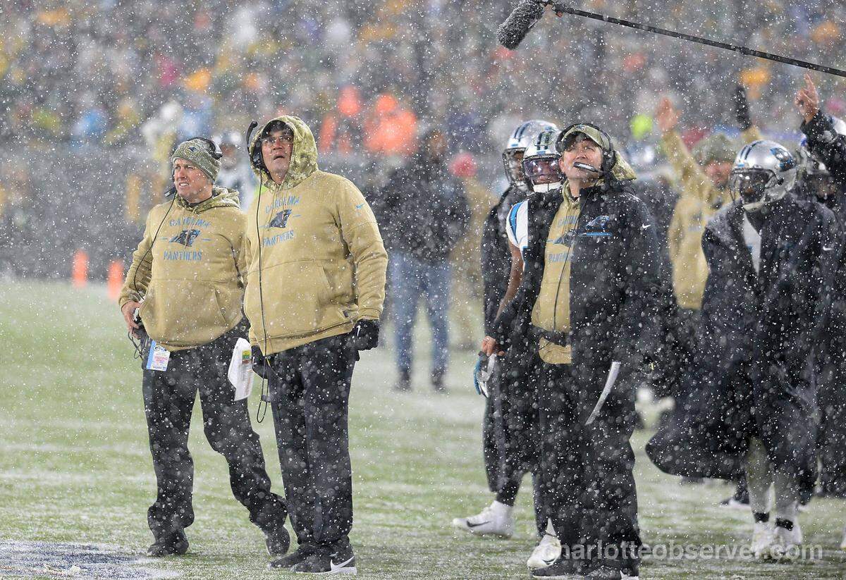 Carolina Panthers head coach Ron Rivera, center, watches a replay in Green Bay during the 2019 season. Rivera was fired Tuesday.
