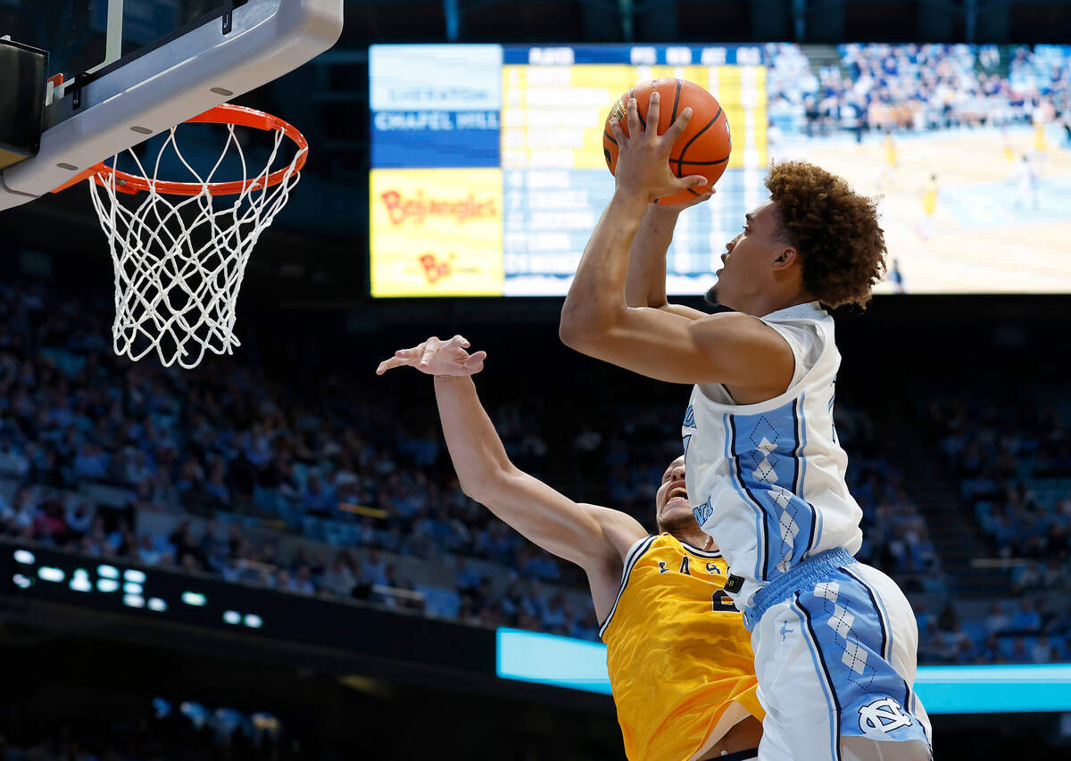 North Carolina’s Seth Trimble drives to the basket past La Salle’s Mac Etienne during the first half of the Tar Heels’ game on Saturday, Dec. 14, 2024, at the Smith Center in Chapel Hill, N.C.