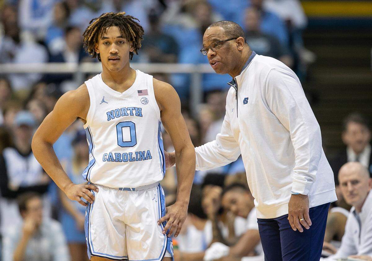 North Carolina coach Hubert Davis talks with Seth Trimble (0) during the first half against Wake Forest on Wednesday, January 4, 2023 at the Smith Center in Chapel Hill, N.C.