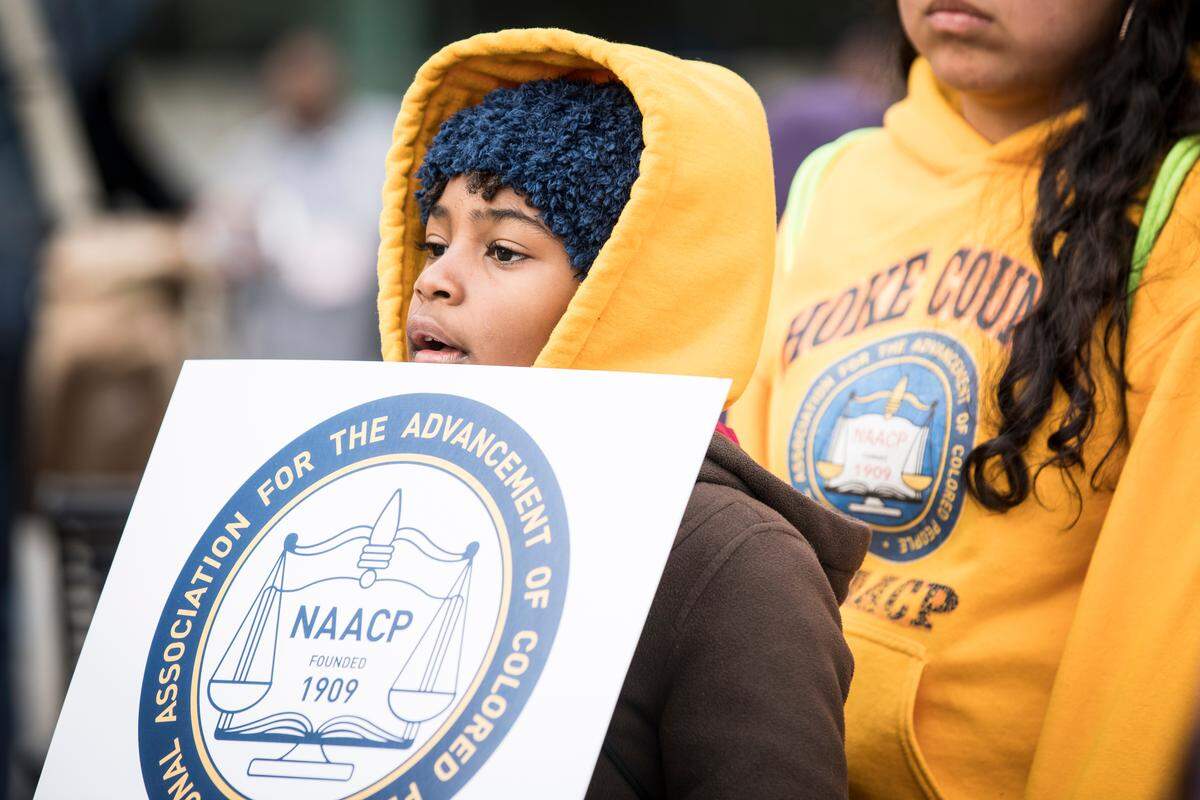 Shani Strickland, 10, attends the 13th annual Moral March on Raleigh with the Hoke County NAACP chapter on Saturday, Feb. 9, 2019.
