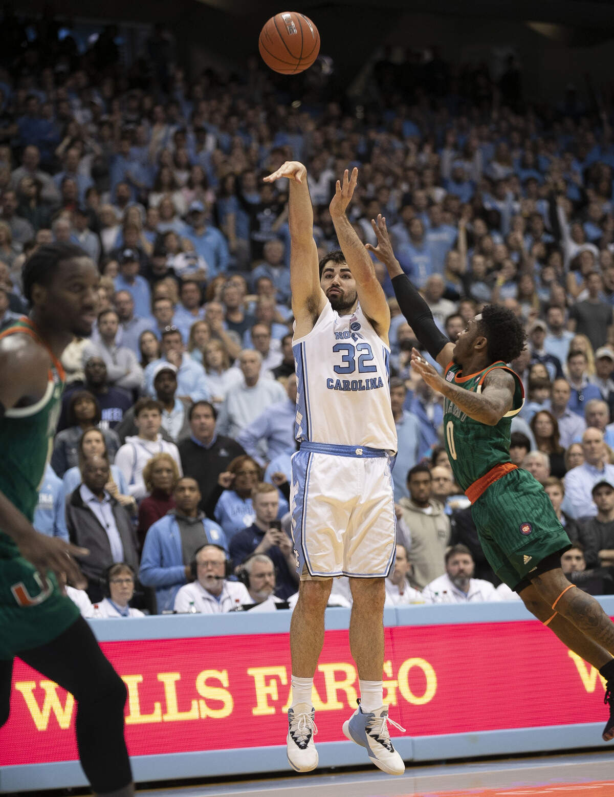 North Carolina’s Luke Maye (32) launches a three-point shot over Chris Lykes (0) with 12 seconds to play to tie the score 77-77 and force overtime on Saturday, February 9, 2019 at the Smith Center in Chapel Hill, N.C.