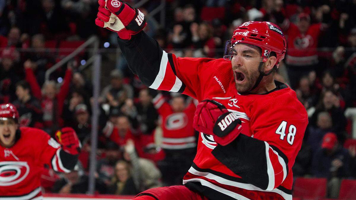 Feb 6, 2024; Raleigh, North Carolina, USA; Carolina Hurricanes left wing Jordan Martinook (48) celebrates his goal against the Vancouver Canucks during the first period at PNC Arena. Mandatory Credit: James Guillory-USA TODAY Sports