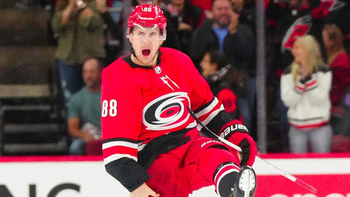 Oct 26, 2023; Raleigh, North Carolina, USA; Carolina Hurricanes center Martin Necas (88) celebrates his game winning goal in the overtime against the Seattle Kraken at PNC Arena. Mandatory Credit: James Guillory-USA TODAY Sports