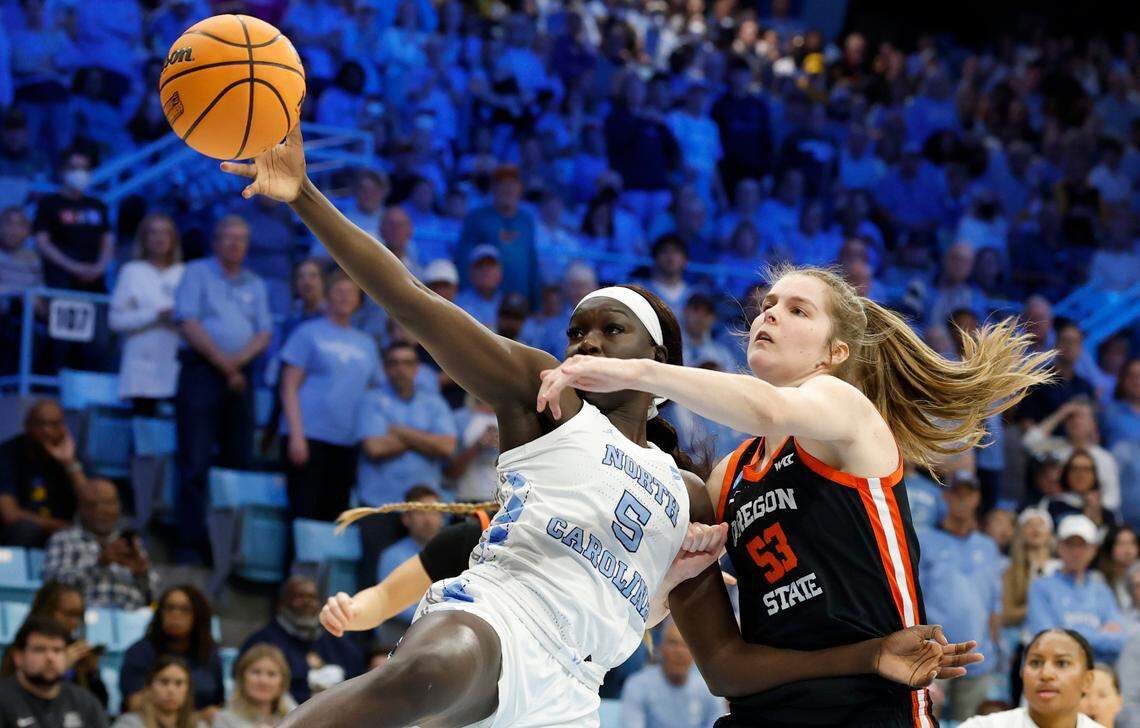 North Carolina’s Maria Gakdeng (5) battles for a rebound with Oregon State’s Kelsey Rees (53) during the first half of UNC’s game against Oregon State in the first round of the NCAA women’s basketball tournament at Carmichael Arena in Chapel Hill, N.C., Saturday, March 22, 2025.